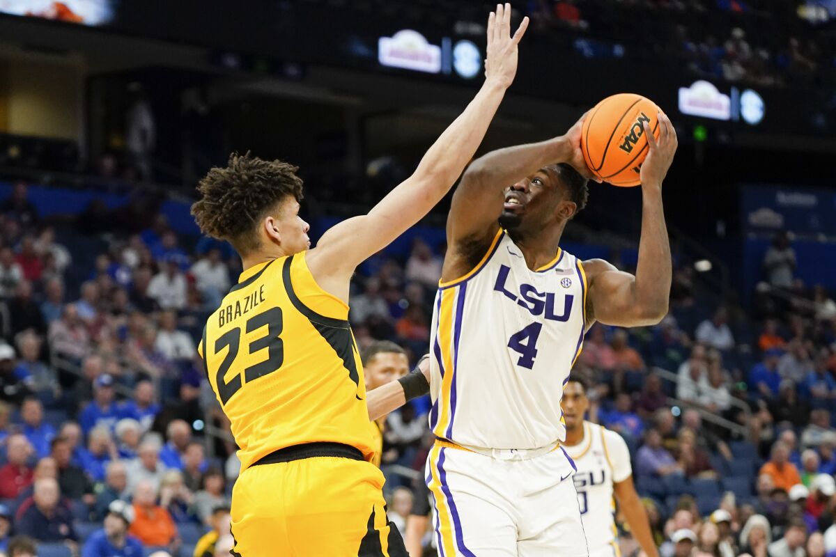 LSU forward Darius Days (4) looks for a shot against Missouri forward Trevon Brazile (23) during the first half of an NCAA men's college basketball game at the Southeastern Conference tournament in Tampa, Fla., Thursday, March 10, 2022. (AP Photo/Chris O'Meara)
