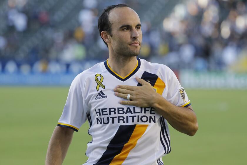 FILE - In this Sept. 11, 2016, file photo, Los Angeles Galaxy's Landon Donovan acknowledges fans after the team's MLS soccer match against Orlando City in Carson, Calif. Donovan knew what had to be done even if meant bringing a startling end to his first season as coach of the expansion San Diego Loyal soccer team. The Loyal forfeited their final two matches of 2020 to protest alleged slurs directed at players. Donovan begins his second season as coach when San Diego visits Phoenix Rising FC on Friday night. (AP Photo/Jae C. Hong. File)