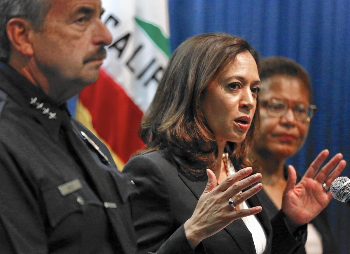 Atty. Gen. Kamal Harris, center, unveils her “Open Justice” initiative in Los Angeles. With her are Los Angeles Police Chief Charlie Beck and U.S. Rep. Karen Bass (D-L.A.).