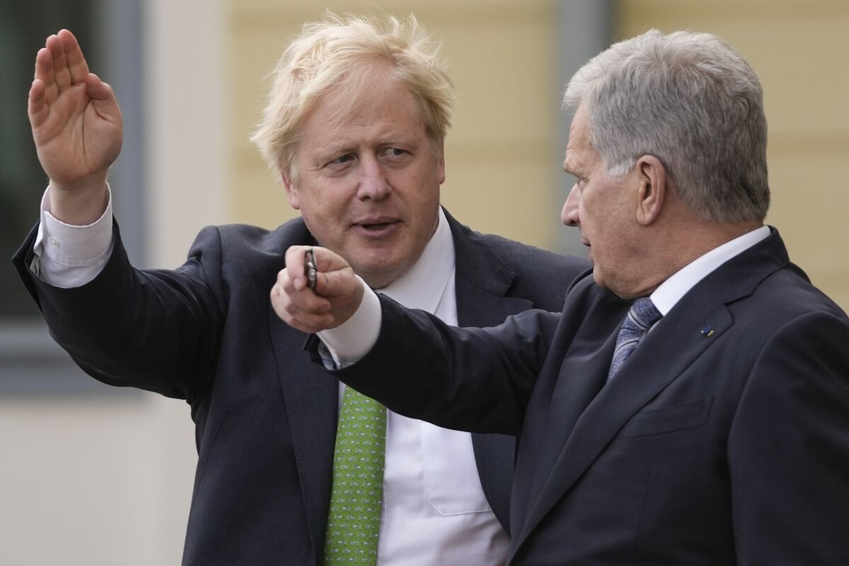 British Prime Minister Boris Johnson, left, talks with Finland's President Sauli Niinisto, at the Presidential Palace in Helsinki, Finland, Wednesday, May 11, 2022. Britain has signed a security assurance with Sweden which like its neighbor Finland is pondering whether to join NATO following Russia's invasion of Ukraine, pledging to "bolster military ties" in the event of a crisis and support both countries should they come under attack. (AP Photo/Frank Augstein, Pool)