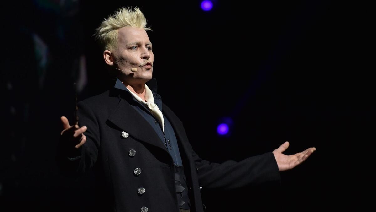 Johnny Depp, in character as Grindelwald, surprises fans at the Warner Bros. theatrical panel for "Fantastic Beasts: The Crimes of Grindelwald" during Comic-Con on July 21, 2018, in San Diego.