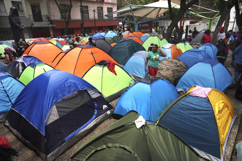 Haitian migrants camp out at the Giordano Bruno plaza in Mexico City, Thursday, May 18, 2023. The group was staying at a shelter in Mexico City on their way north but were forced to make camp at the park after the shelter closed. (AP Photo/Marco Ugarte)