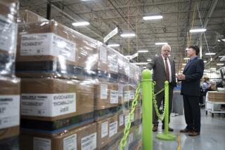 Minnesota Gov. Tim Walz tours Phillips & Temro with CEO Tom Moser, Monday, July 26, 2021, where he announced final adoption of Minnesota's new clean cars rules. The company is a pioneer of electric vehicle battery heating technologies and charging systems in Eden Prairie, Minn. Minnesota became the first Midwestern state to adopt a plan for encouraging the switchover to electric vehicles, as Gov. Walz predicted that someday people will wonder why there was such as fuss. (Glen Stubbe/Star Tribune via AP)