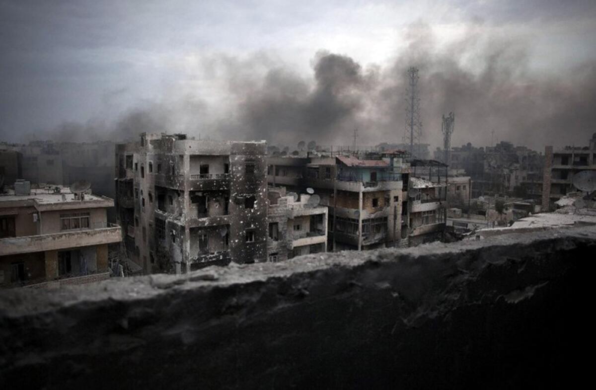 Smoke rises over Aleppo, Syria, on Oct. 2, 2012.