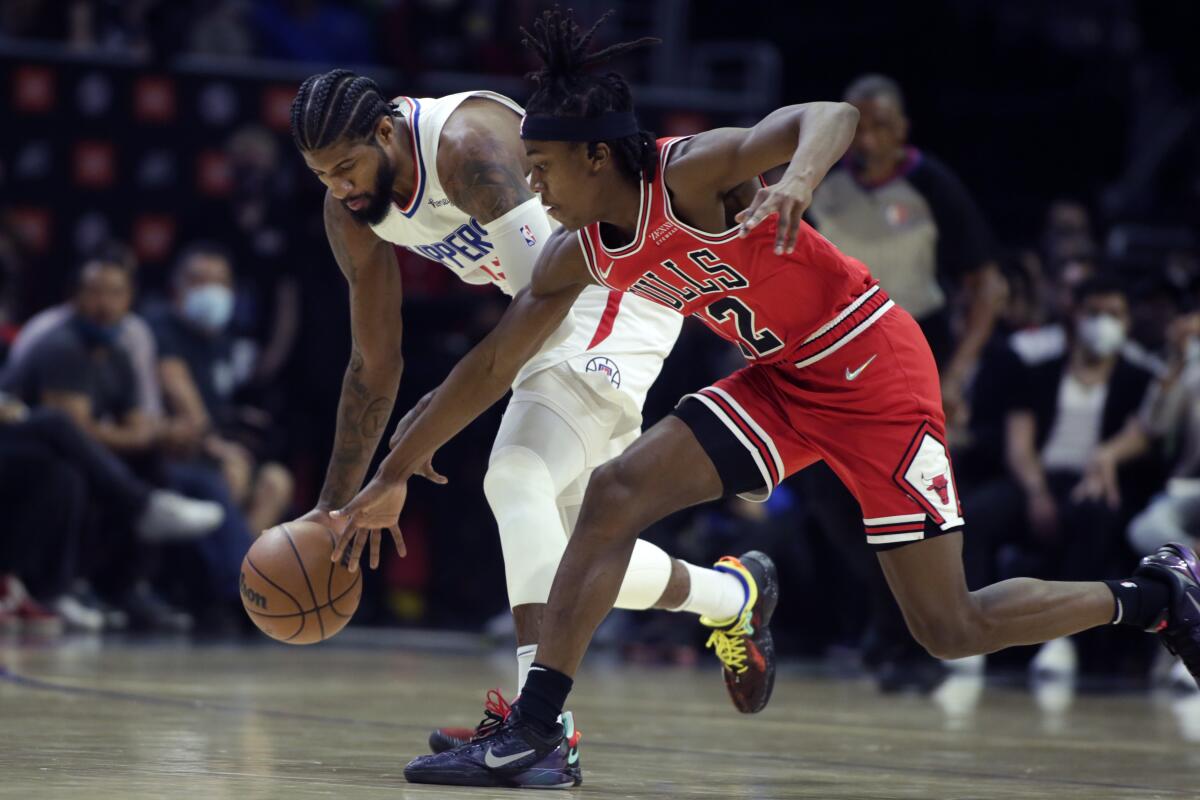 Clippers guard Paul George steals the ball from Chicago Bulls guard Ayo Dosunmu.