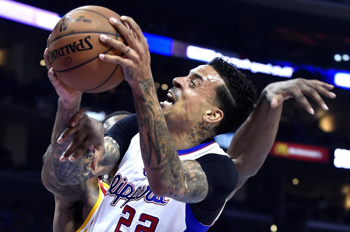 Former Clipper Matt Barnes is fouled by the Houston Rockets' Terrence Jones on a shot attempt during an NBA playoff game on May 10.