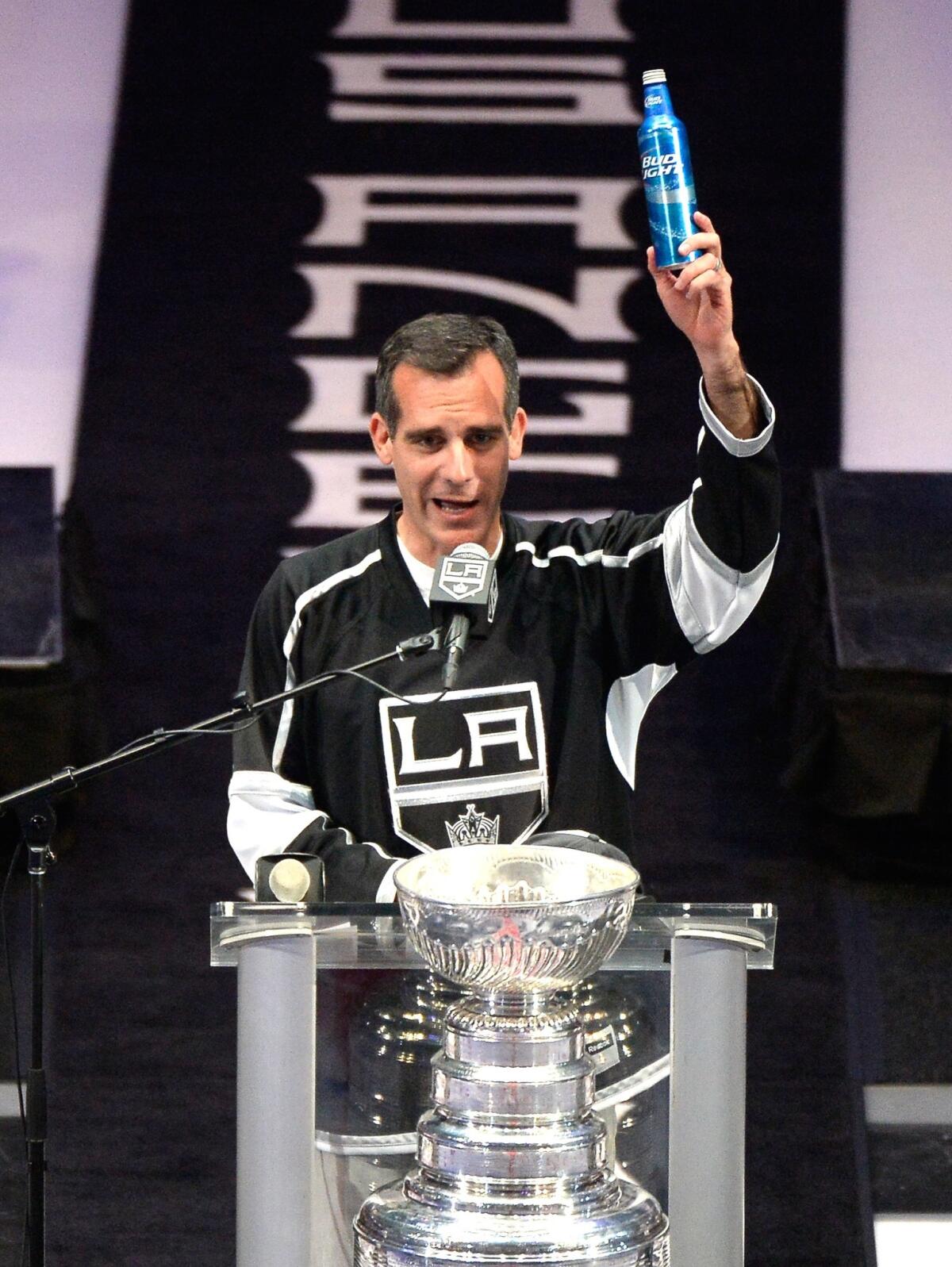 Mayor Eric Garcetti raises a beer and swears after the Kings' victory parade on June 16 in downtown Los Angeles.