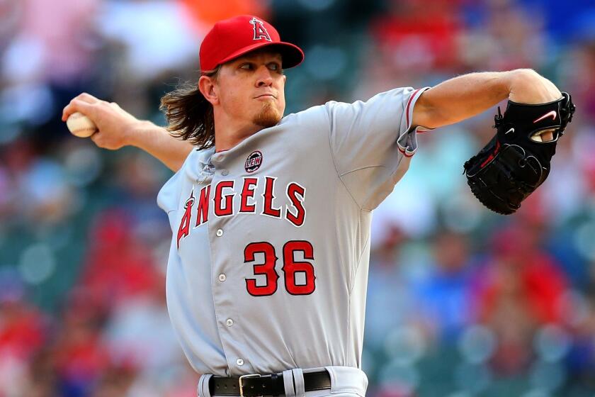 Angels starter Jered Weaver delivers a pitch during the team's 4-3 loss to the Texas Rangers on Monday.