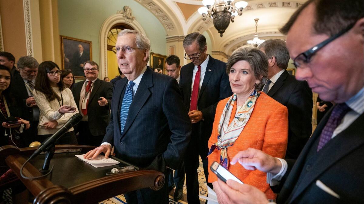 Senate Majority Leader Mitch McConnell (R-Ky.) and several members of the Senate Republican caucus meet with reporters in the U.S. Capitol March 5.