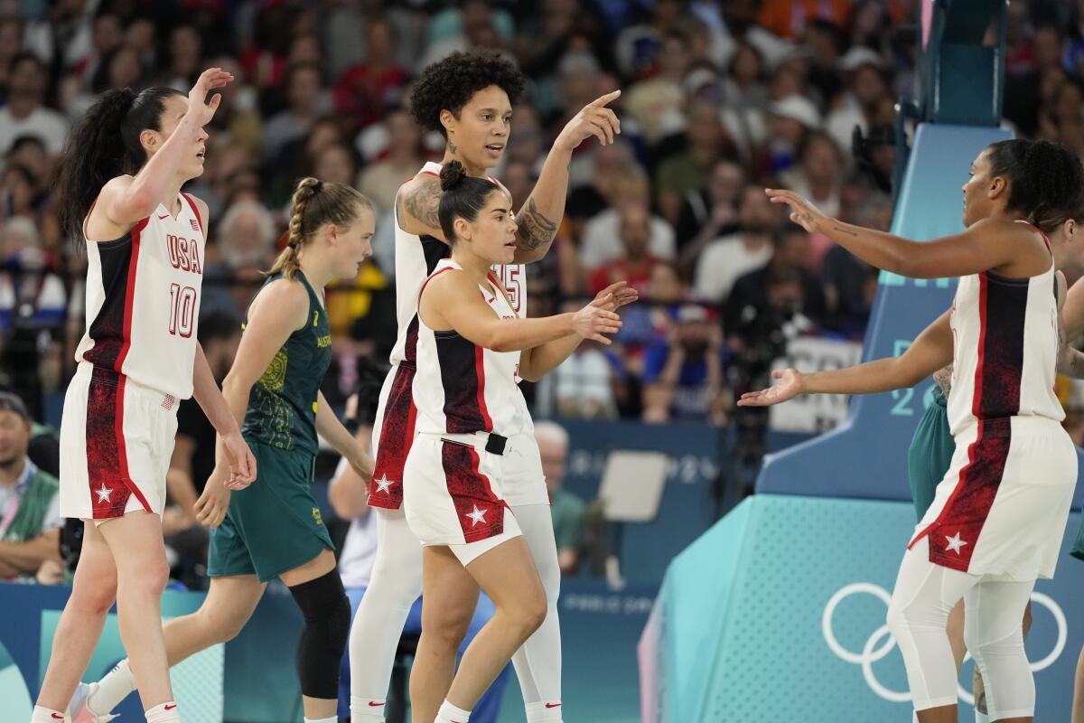 U.S. players celebrate during a win over Australia in the Olympic women's basketball semifinals on Friday.