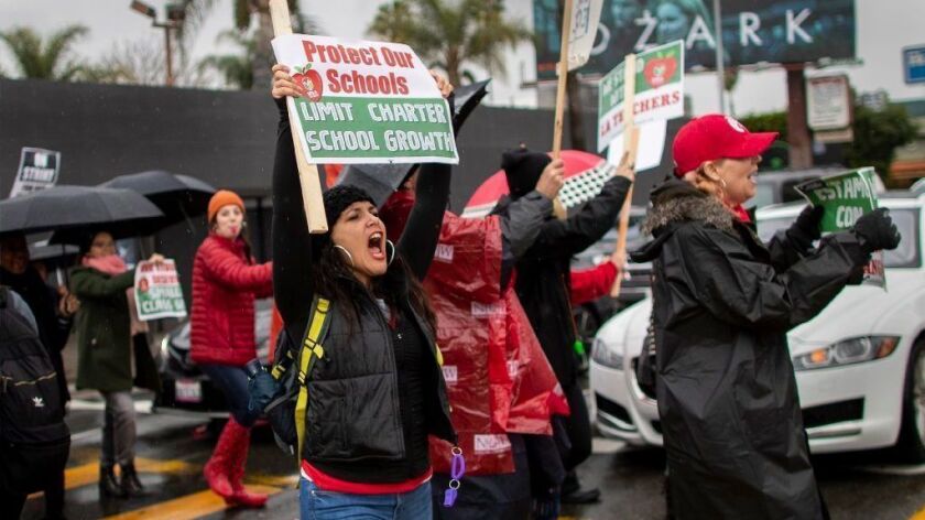 Parents, teachers and students picket outside Hollywood High School during the second day of the United Teachers Los Angeles strike.