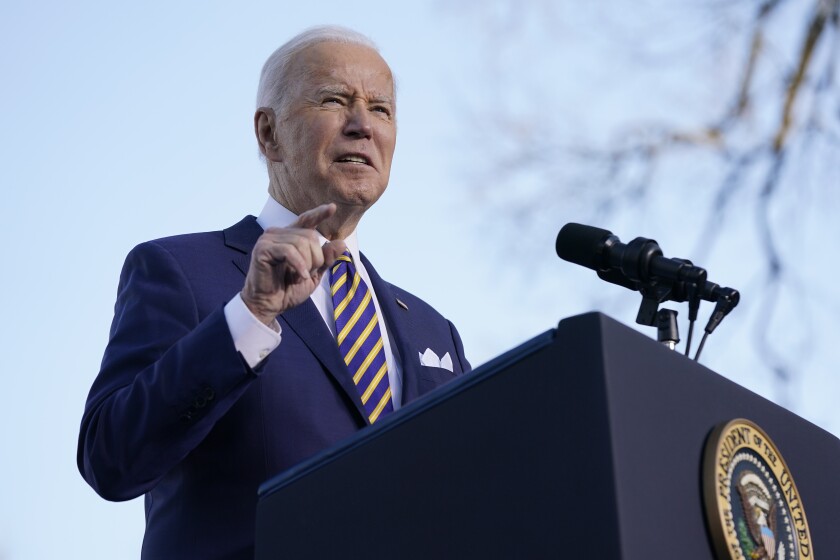 President Biden behind a podium.