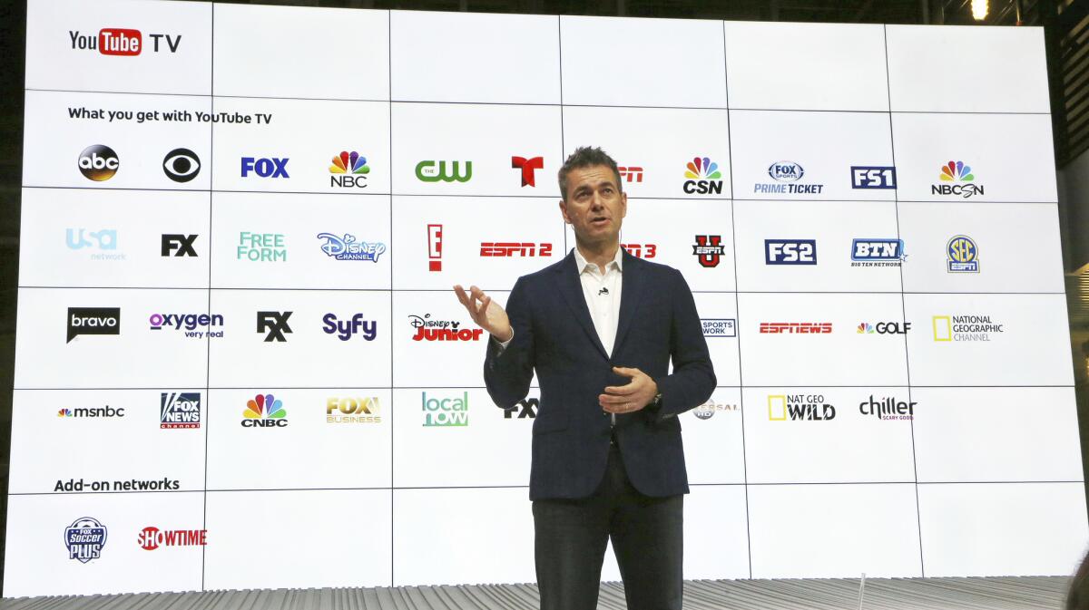 YouTube Chief Business Officer Robert Kuncl, with a graphic showing the many networks that will be carried, speaks during the introduction of YouTube TV in Playa Vista on Tuesday.