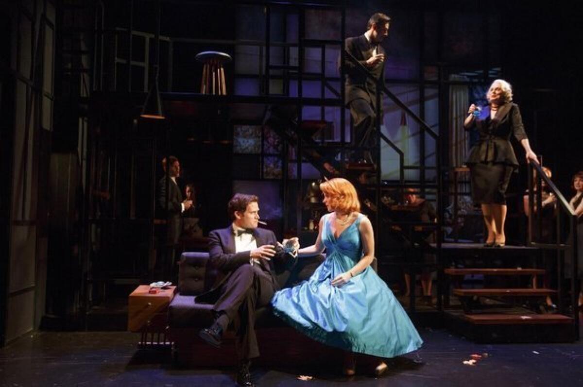 Stephen Pasquale and Kelli O'Hara, along with members of the company in a scene from the musical version of the 2002 movie "Far from Heaven" at Playwrights Horizons in New York.