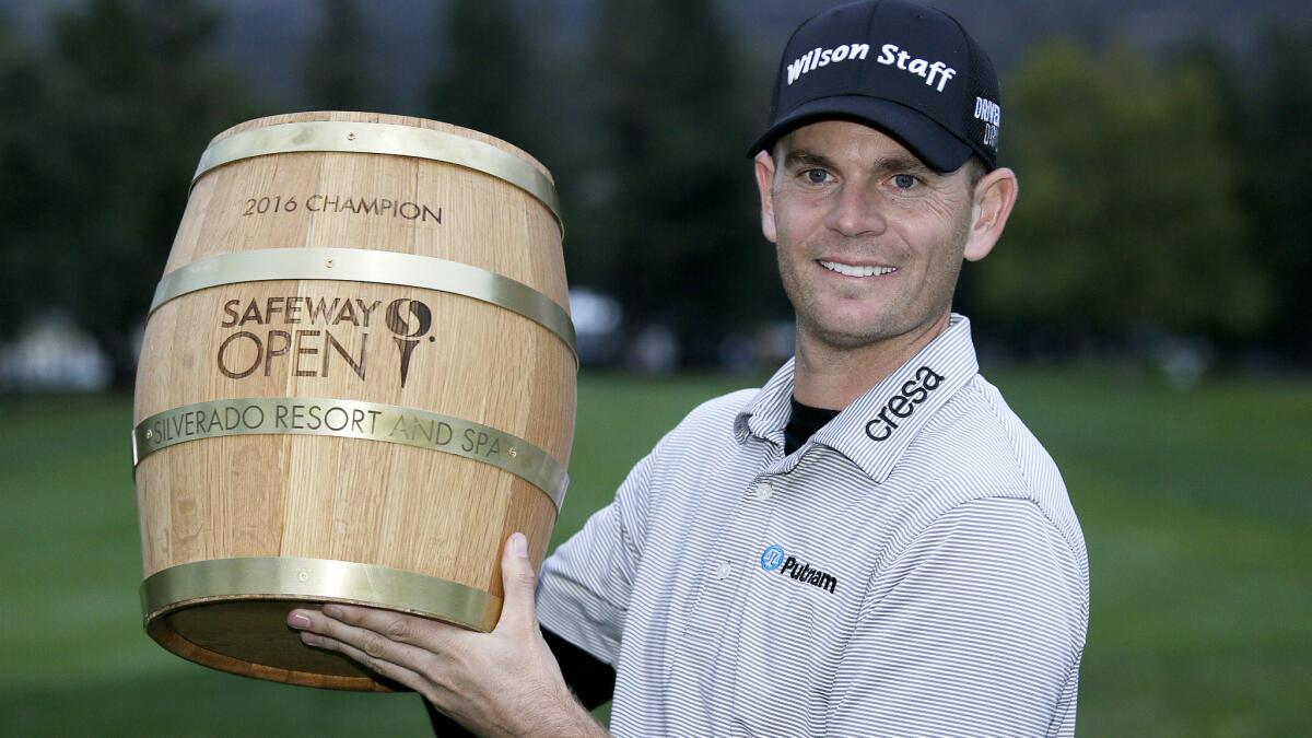 Brendan Steele poses with his trophy on the 18th green after winning the Safeway Open on Sunday.