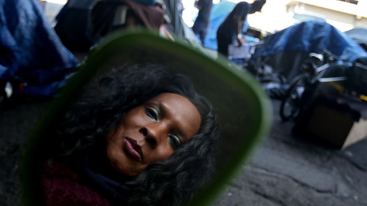 Dayna Catchings, photographed last month at her homeless encampment under a freeway in downtown Los Angeles.