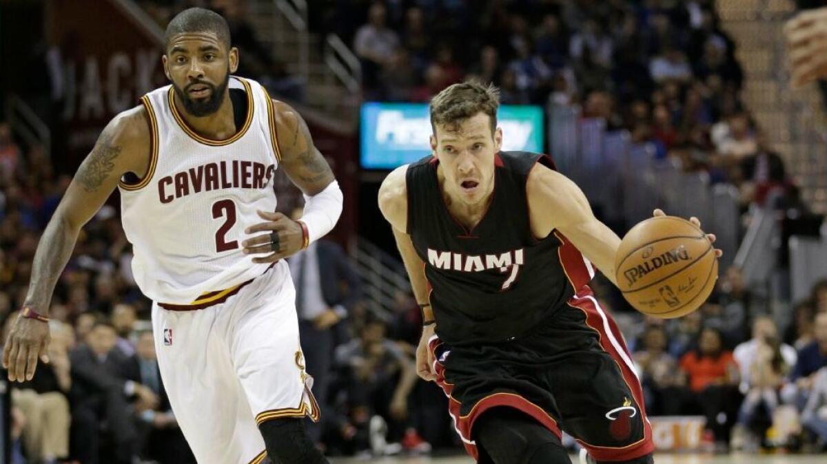 Heat gurad Goran Dragic (7) drives against Cavaliers guard Kyrie Irving (2) in the second half on Mar. 6.