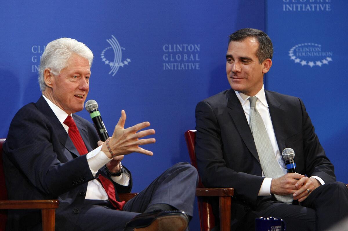 Former President Bill Clinton, left, and Los Angeles Mayor Eric Garcetti during the Clinton Global Initiative forum on public infrastructure at Los Angeles City Hall.