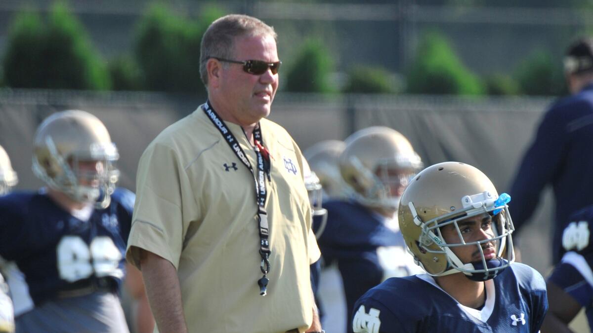 Notre Dame Coach Brian Kelly looks on during a practice session on Aug. 9. Kelly said he has not spoken to the players involved in an investigation over alleged academic misconduct.