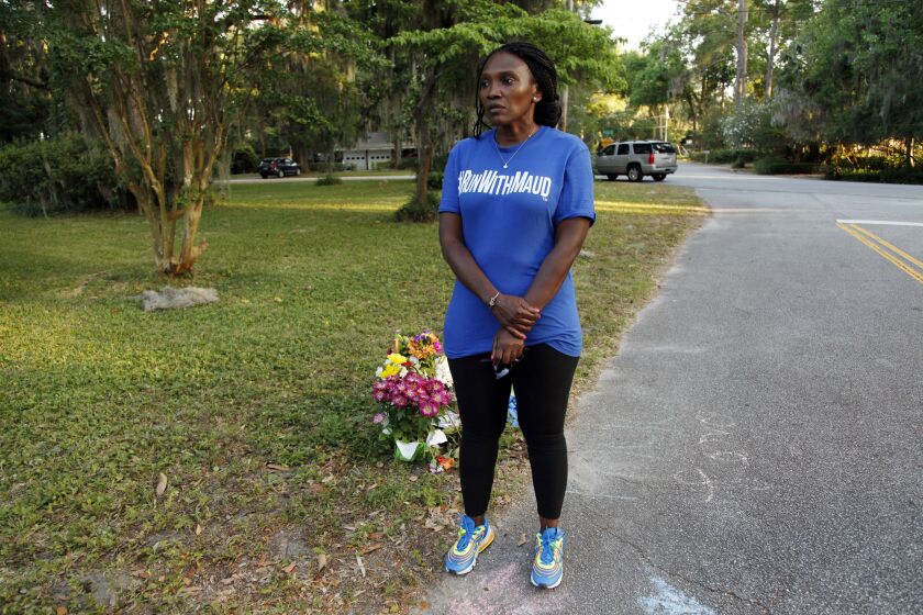 In this May 17, 2020, photo, Wanda Cooper-Jones stands near the spot where her son Ahmaud Arbery was shot and killed.