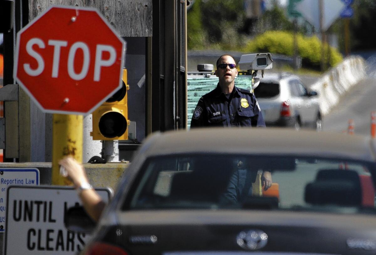 A U.S. Customs and Border Protection officer at the U.S.-Canada border in Blaine, Wash.