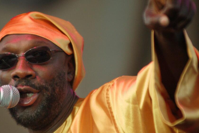 Rock and Roll Hall of Fame member and Academy and Grammy award winning artist Isaac Hayes performs Wednesday, Aug. 28, 2002, at the Michigan State Fair in Detroit. The fair ends on Labor Day with a performance by native Detroiter Alice Cooper. Hayes has become famous to a new generation of fans as the voice of "Chef" on the animated television series "South Park". (AP Photo/Paul Warner) ORG XMIT: MIPW101