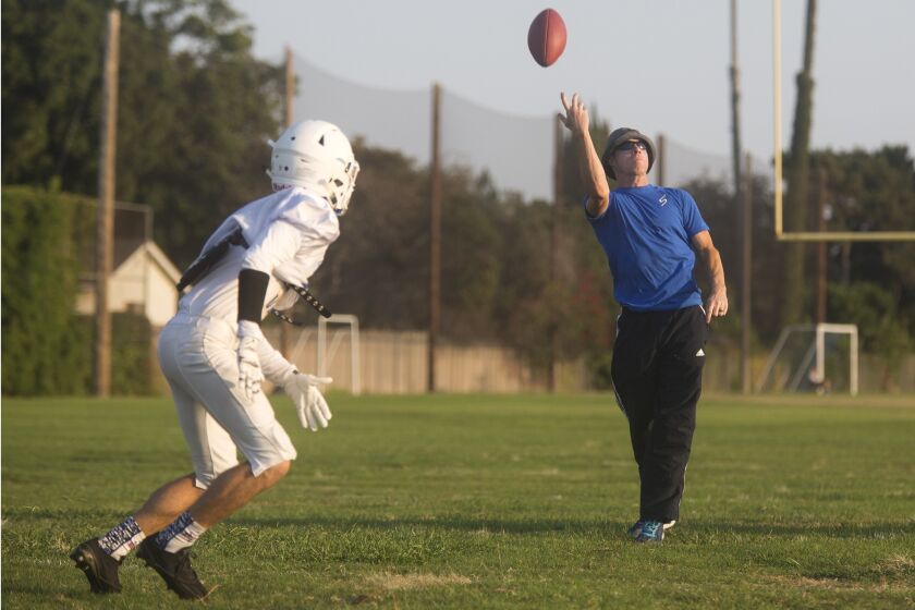 Coach Jimmy Nolan throws the ball during practice Tuesday afternoon in Fountain Valley. ///ADDITIONAL INFO: 2478117_tn_hbi_sp_0825_fv_football_preview 08/23/16 - Photo by DREW A. KELLEY, CONTRIBUTING PHOTOGRAPHER