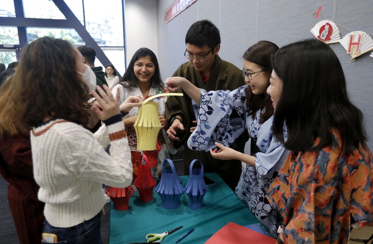 Guests enjoy making paper lanterns at the annual Lunar New Year celebration.