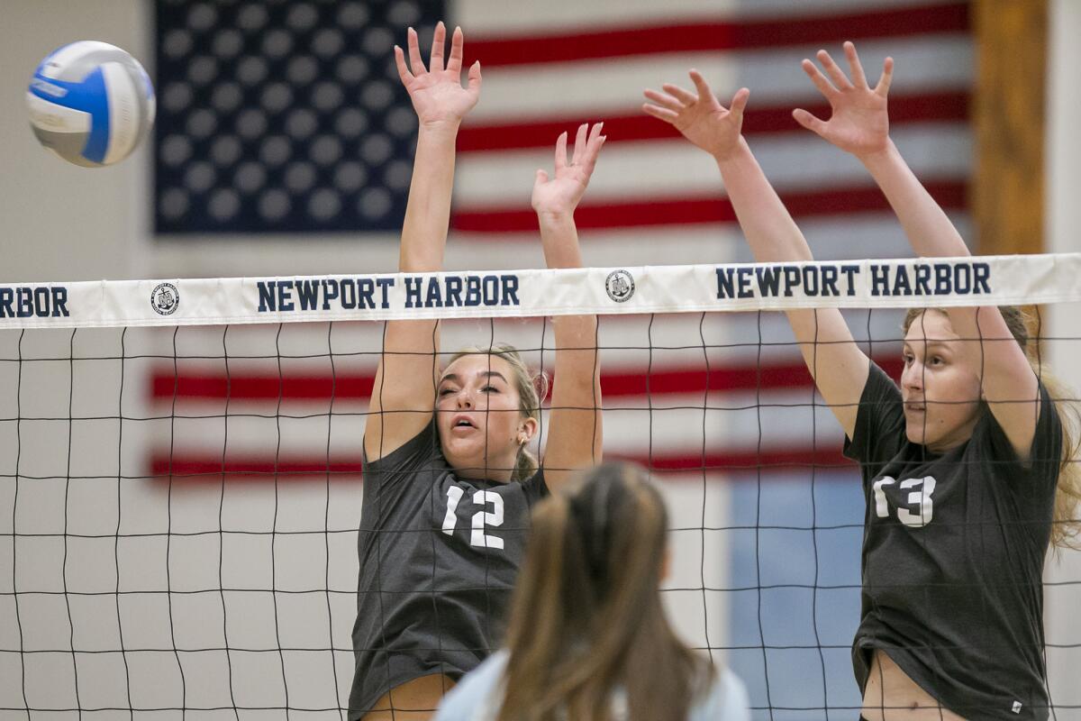 Marina's Dominique Vadeboncoeur, left, and Mater Dei's Liv Hertzog go up to block a ball on Tuesday.