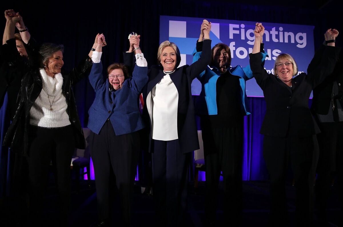 WASHINGTON, DC - NOVEMBER 30: Democratic presidential candidate Hillary Clinton (3rd L) holds up hands with (L-R) Sens. Barbara Boxer (D-CA), Barbara Mikulski (D-MD), and Patty Murray (D-WA) during a 'Women for Hillary' fundraiser November 30, 2015 in Washington, DC. All 14 Democratic women senators, except Sen. Elizabeth Warren (D-MA) have endorsed Hillary Clinton to run for the President of the U.S. (Photo by Alex Wong/Getty Images) ** OUTS - ELSENT, FPG, CM - OUTS * NM, PH, VA if sourced by CT, LA or MoD **