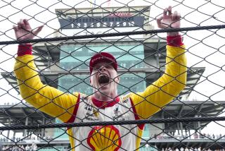 Josef Newgarden celebrates after winning the Indianapolis 500 auto race.