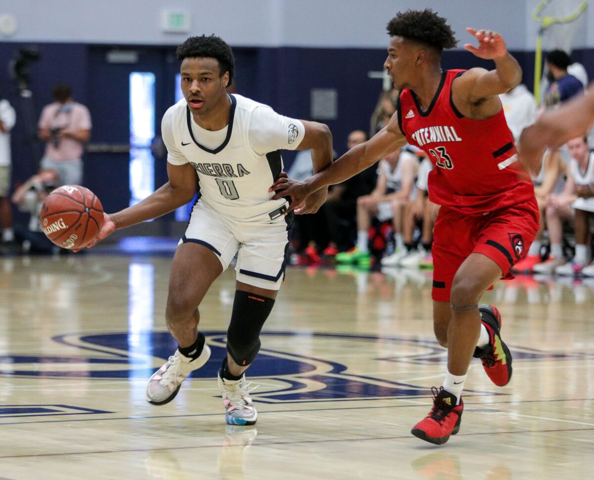 Sierra Canyon’s Bronny James moves the ball up the court against Corona Centennial’s Ramsey Huff.