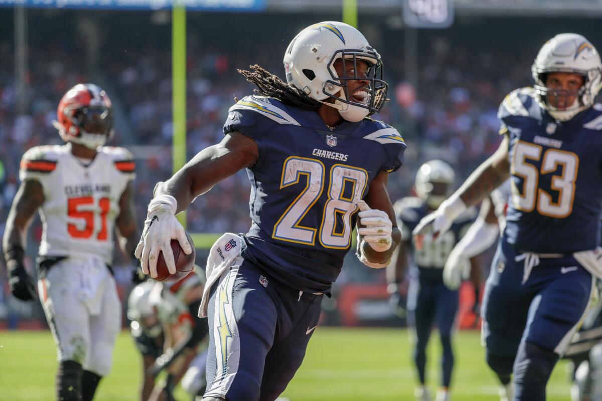 Chargers running back Melvin Gordon III smiles as he runs into the endzone for an 11-yard, third quarter touchdown against the Cleveland Browns at Firstenergy Stadium on Sunday.