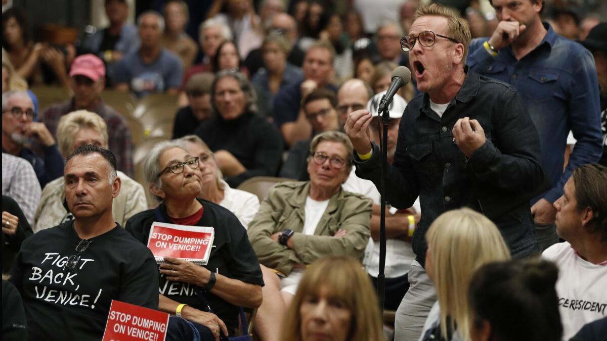 Anthony Wells, a 30-year Venice resident, voices his opposition to a planned homeless shelter during a town hall meeting Wednesday night.
