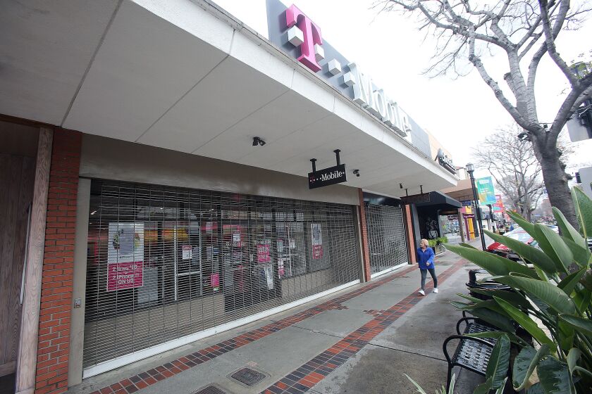 T-Mobile, temporarily closed on San Fernando Road in Burbank on Thursday, March 19, 2020. Stores in the area are a mix of being open, open for takeout only, or temporarily closed.