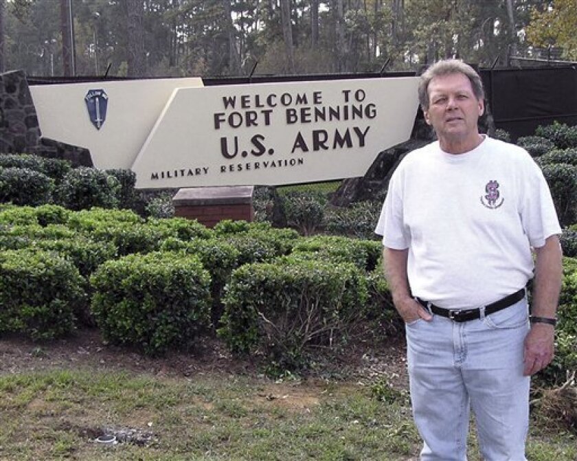 *Catholic priest Roy Bourgeois stands outside the main gate to Fort Benning in this Nov. 15, 2005 file photo., in Columbus, Ga. Bourgeois faces excommunication for supporting the ordination of women priest. His excommunication would likely be automatic, requiring no further action from the Holy See, said the chief Vatican spokesman, the Rev. Federico Lombardi. (AP Photo/Elliott Minor, file)