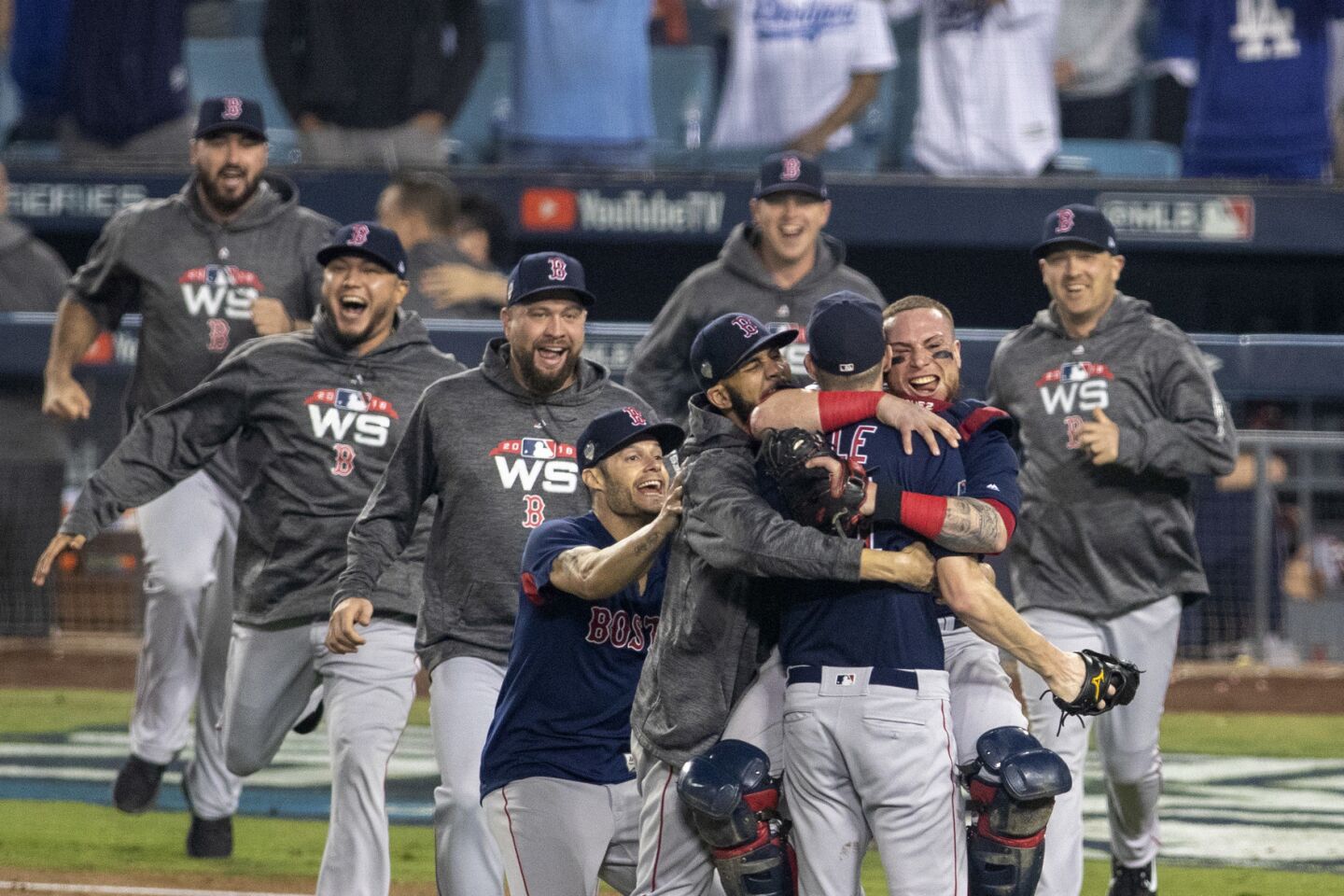 Red Sox players celebrate beating the Dodgers 5-1 and winning game five and the World Series.