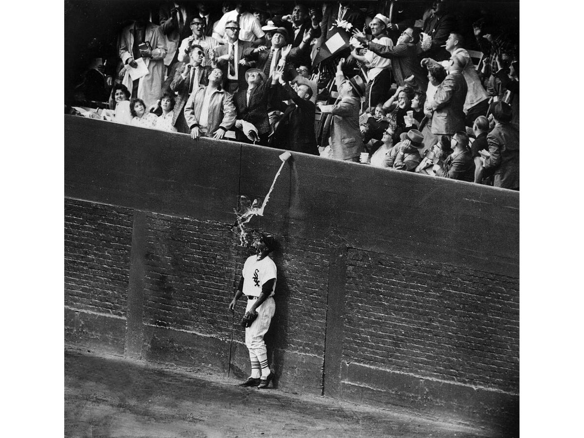 Oct. 2, 1959: Chicago White Sox outfielder Al Smith is drenched by a cup of beer as fans try to catch Los Angeles Dodgers' Charlie Neal's fifth inning home run during the World Series game in Chicago. Neal’s home run tied the game 2-2. The Dodgers won 4-3. 