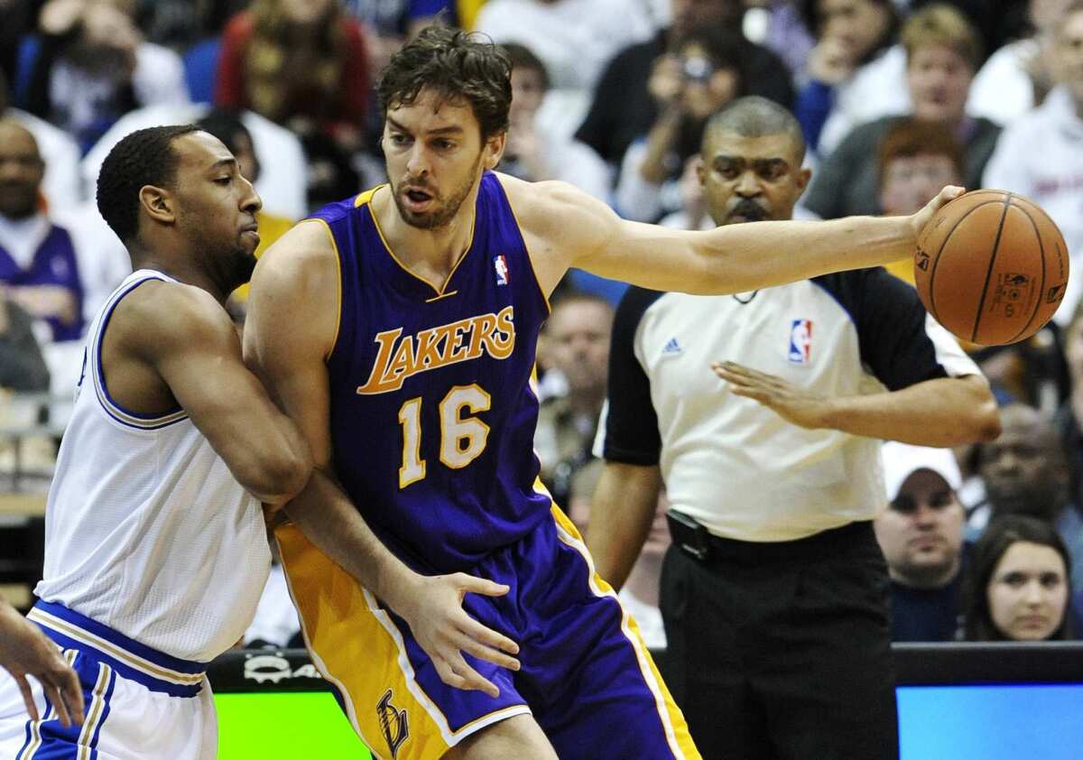 Lakers power forward Pau Gasol works in the post against Timberwolves power forward Derrick Williams. This season will start off with a challenge for the Lakers.