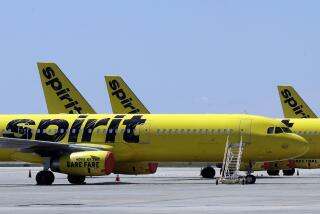 FILE - A line of Spirit Airlines jets sit on the tarmac at Orlando International Airport on May 20, 2020, in Orlando, Fla. A 6-year-old boy who left on a flight for the Christmas holiday to visit his grandmother was put on the wrong plane. When the grandmother, up on Thursday, Dec. 21, 2023 at the airport in Fort Myers to greet her grandson who was flying for the first time from Philadelphia, she was told he wasn’t on the Spirit Airlines flight. (AP Photo/Chris O'Meara, File)