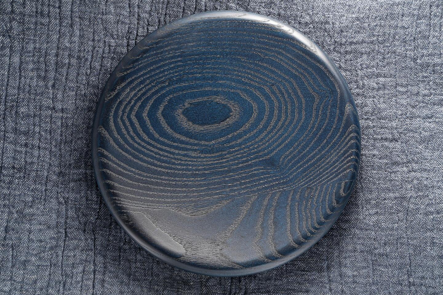 Indigo-stained wooden bowl