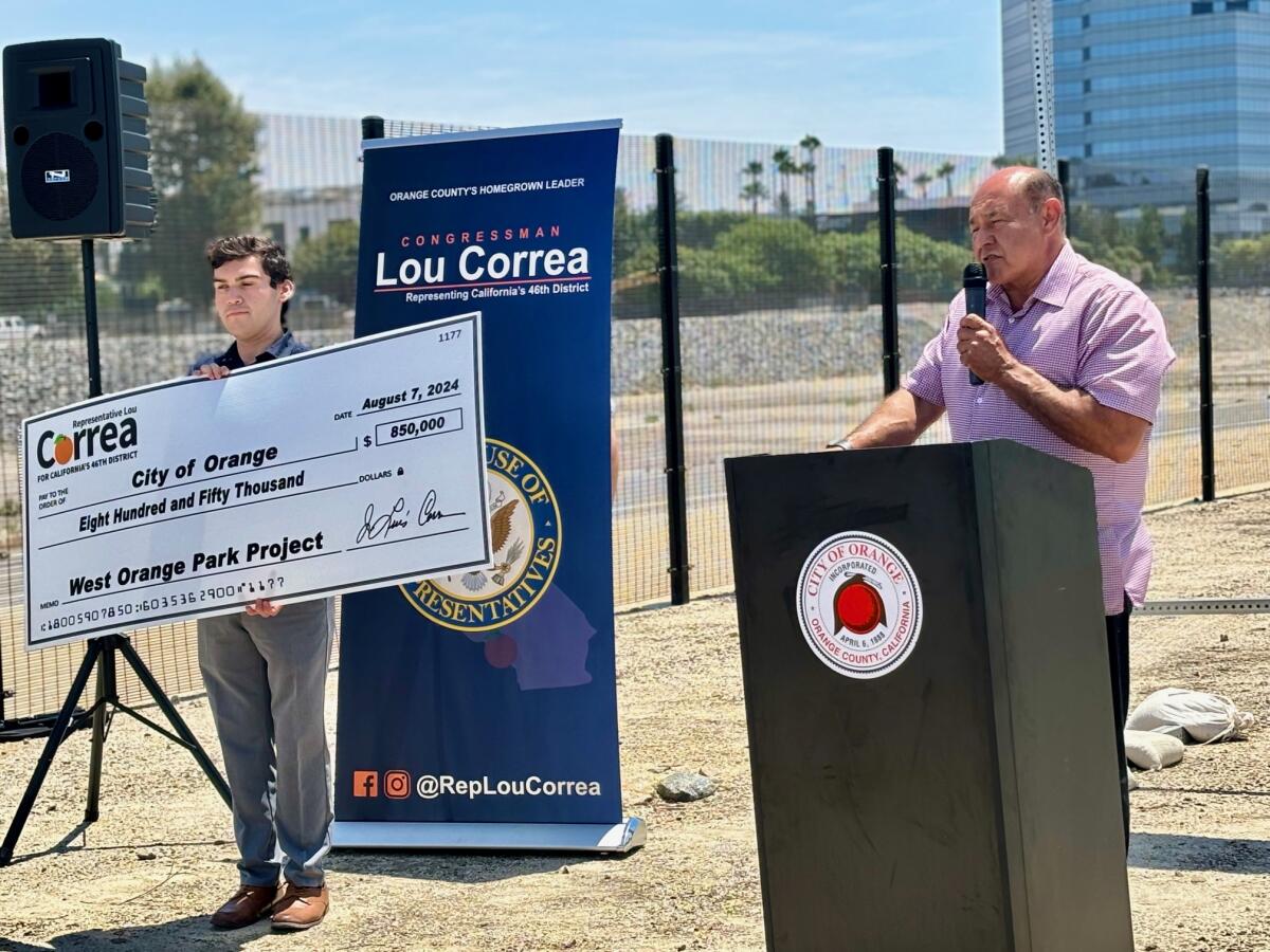 Representative Lou Correa (CA-46) presents a check to help build the West Orange Park.