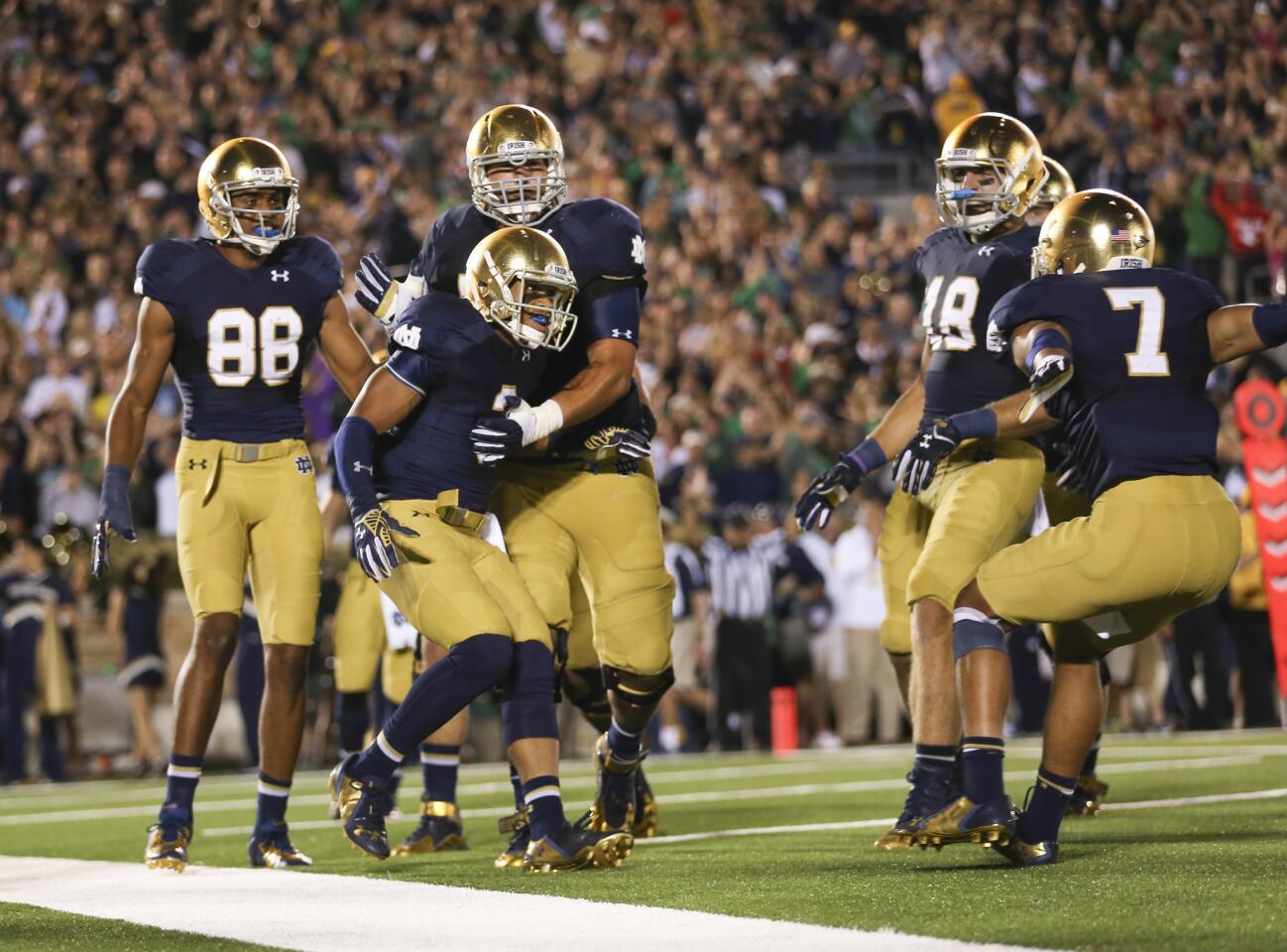 Notre Dame wide receiver Amir Carlisle (3) celebrates with teammates after his touchdown during the second half.