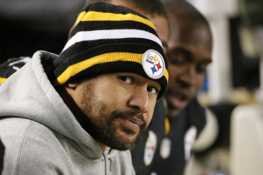 Pittsburgh Steelers strong safety Troy Polamalu looks on from the sideline after suffering a right knee injury during Sunday's win over the Baltimore Ravens.