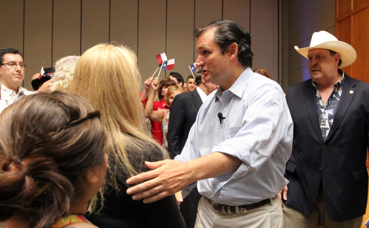 Sen. Ted Cruz, shown greeting people at a Republican Party event in Conroe, Texas, isn't a fan of national healthcare. But it turns out he was born in Canada, which has such a system.