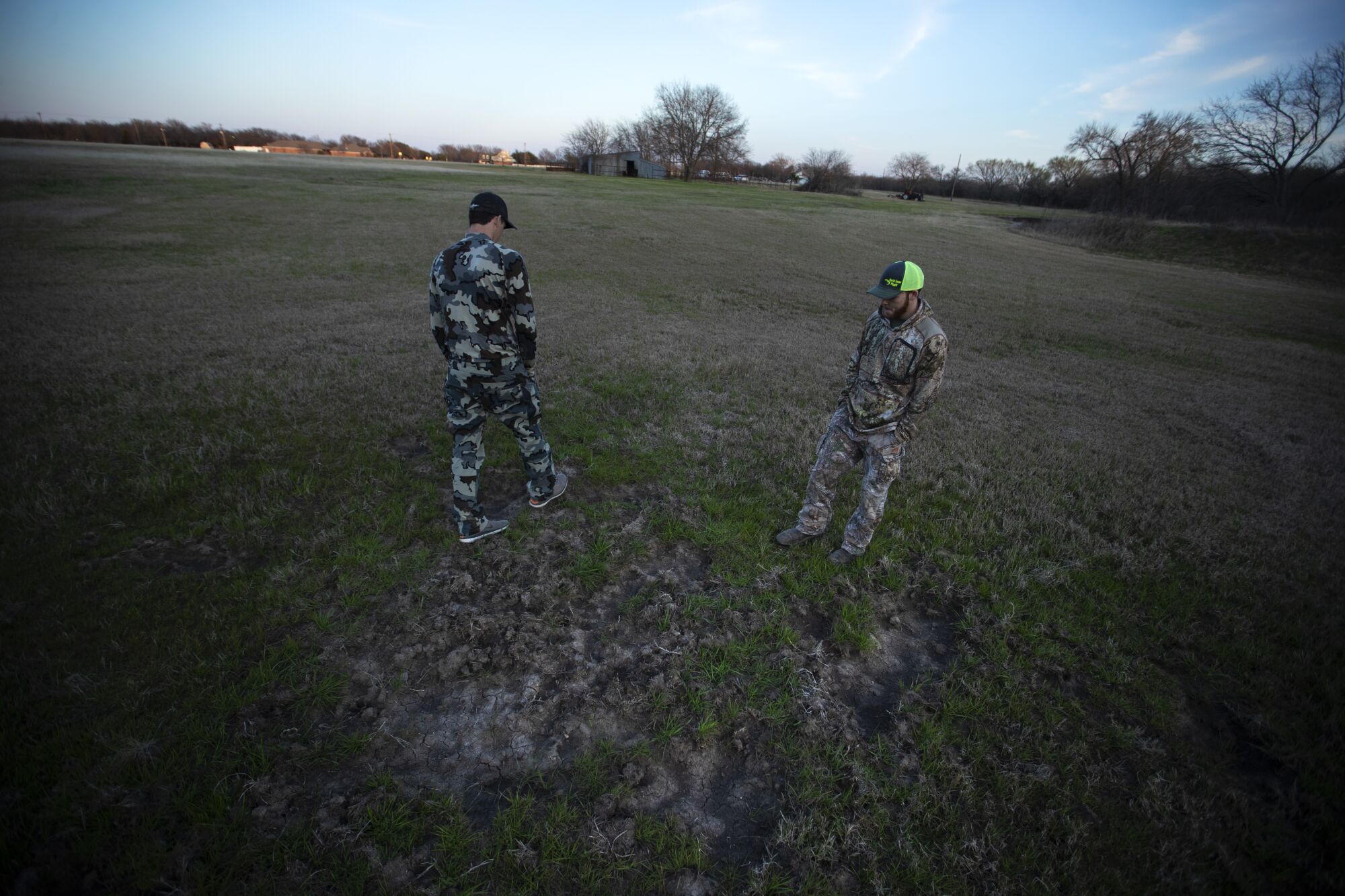 Hog hunters Sam Longhenry, left, and Dustin Parker in Wise County.