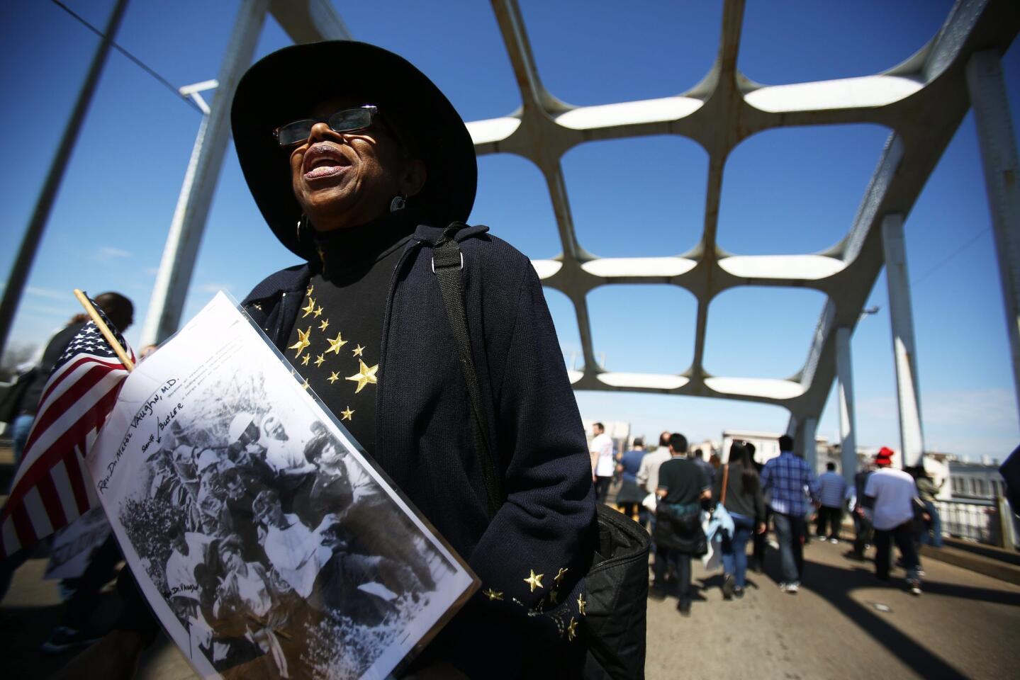 Dorothy Vaughn walks across the Edmund Pettus Bridge during the 50th anniversary commemoration of the 'Bloody Sunday' crossing in Selma, Alabama. Nearly 600 people marching for voting rights from Selma to Montgomery, Alabama, USA, on 07 march 1965 were tear-gassed and beaten by a county posse and state troopers at the bridge. The events led to passage of the voting rights act by the US Congress.