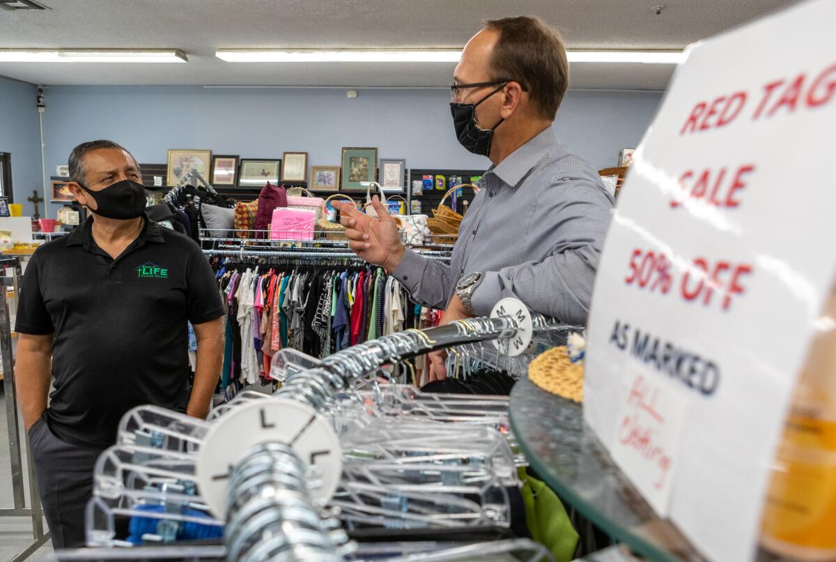 Tim Yzaguirre and Donnie Dee  in the Bread of Life Thrift Store.