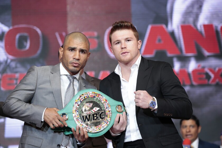 Puerto Rican middleweight champion Miguel Cotto, left, and Mexican challenger Saul 'Canelo' Alvarez will fight on Nov. 21 in Las Vegas.
