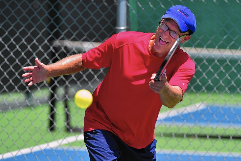 Pickleball champion Ford Roberson practices in Denton, Texas. The game has gone from its goofing off with the kids origins to a fast-growing sport that draws all ages.